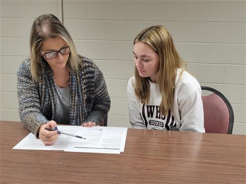 School Counselor Mrs. Frantz working with a High School Student 